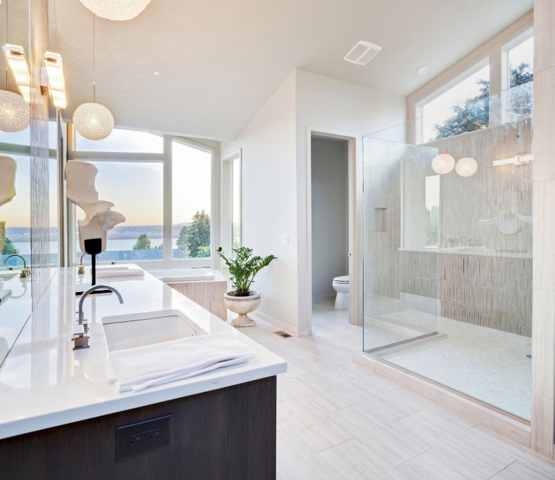 Modern bathroom renovation with glass shower enclosure